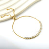 Elegante gouden armband met edelstenen