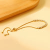 Elegante gouden armband met edelstenen
