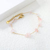 Elegante gouden armband met edelstenen