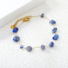 Elegante gouden armband met edelstenen