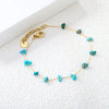 Elegante gouden armband met edelstenen